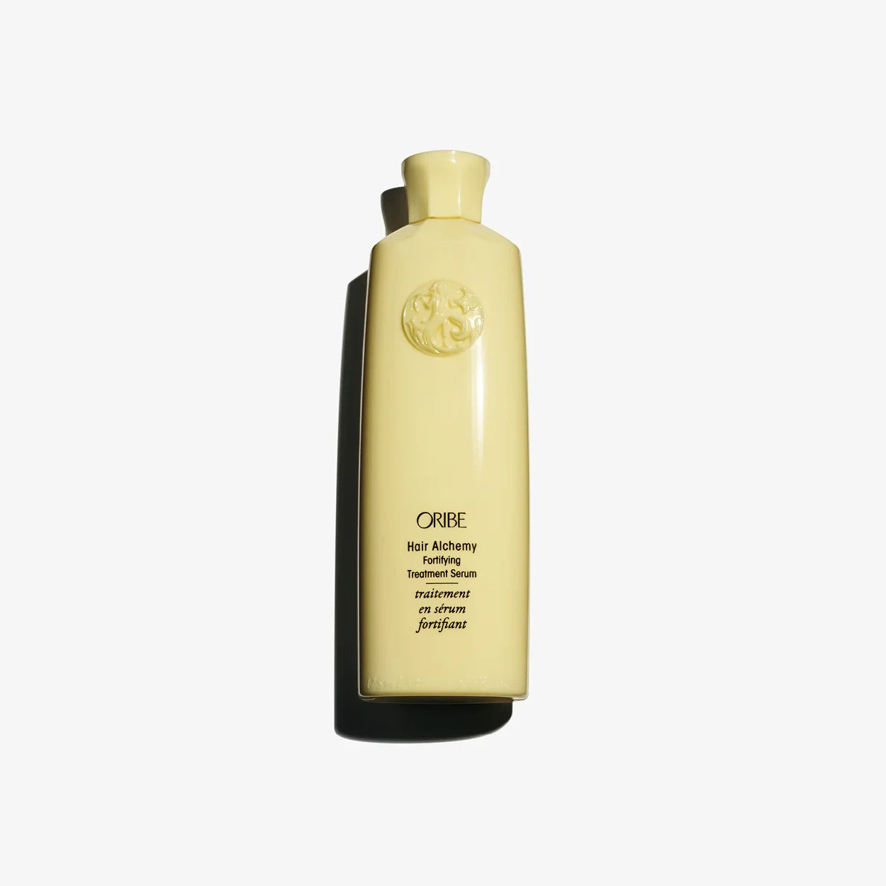 Shop Rescue Spa Oribe Hair Alchemy Fortifying Treatment Serum in a pale yellow bottle for strengthening fragile hair.