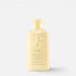 Shop Rescue Spa Oribe Hair Alchemy Fortifying Treatment Serum in a pale yellow bottle with embossed logo detail.
