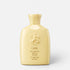 Shop Rescue Spa Oribe Hair Alchemy Resilience Shampoo in a pale yellow bottle with embossed logo detail