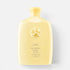 Shop Rescue Spa Oribe Hair Alchemy Resilience Shampoo in a pale yellow bottle with an embossed circular logo.