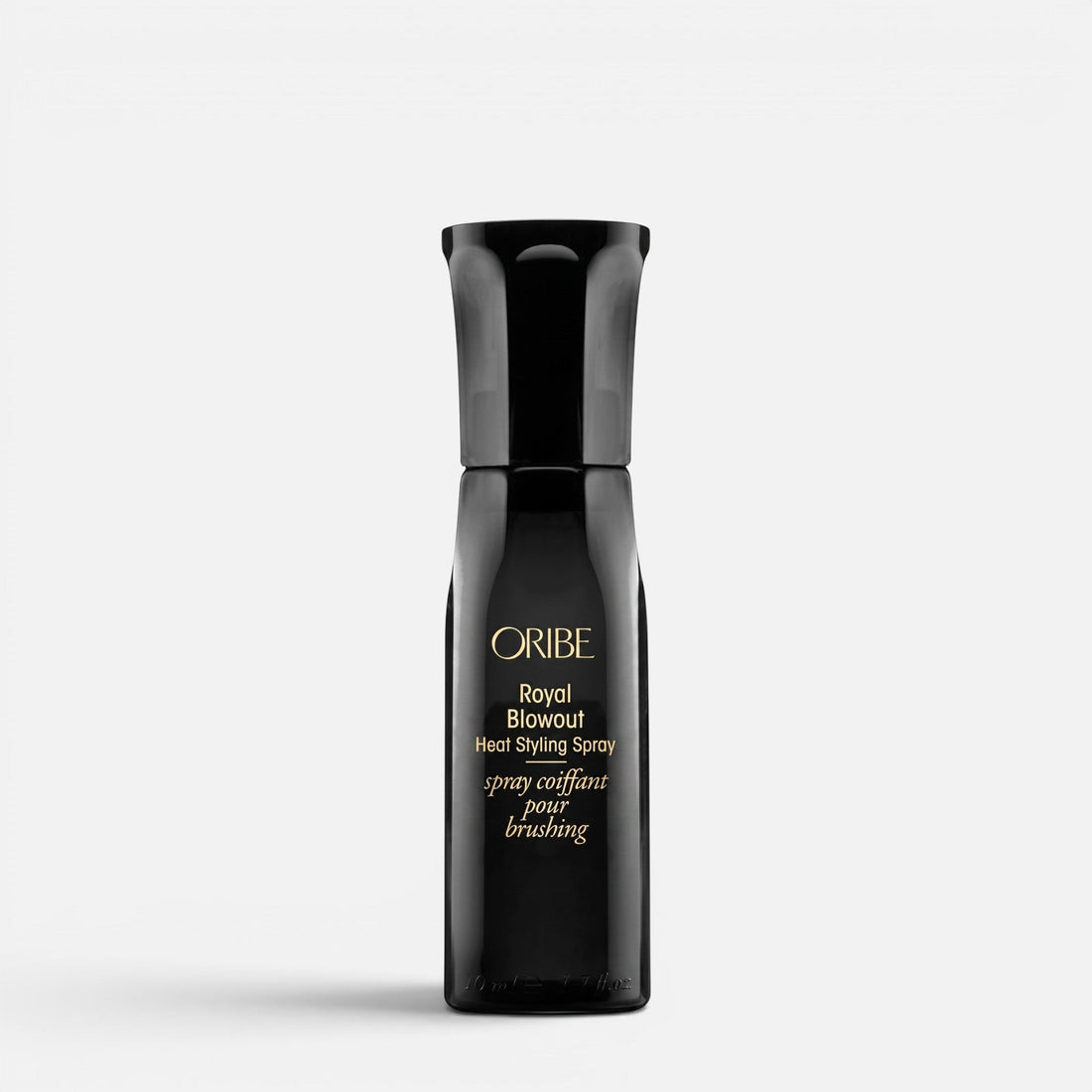 Shop Rescue Spa Oribe Royal Blowout Heat Styling Spray in a sleek black bottle for heat protection and smooth hair.