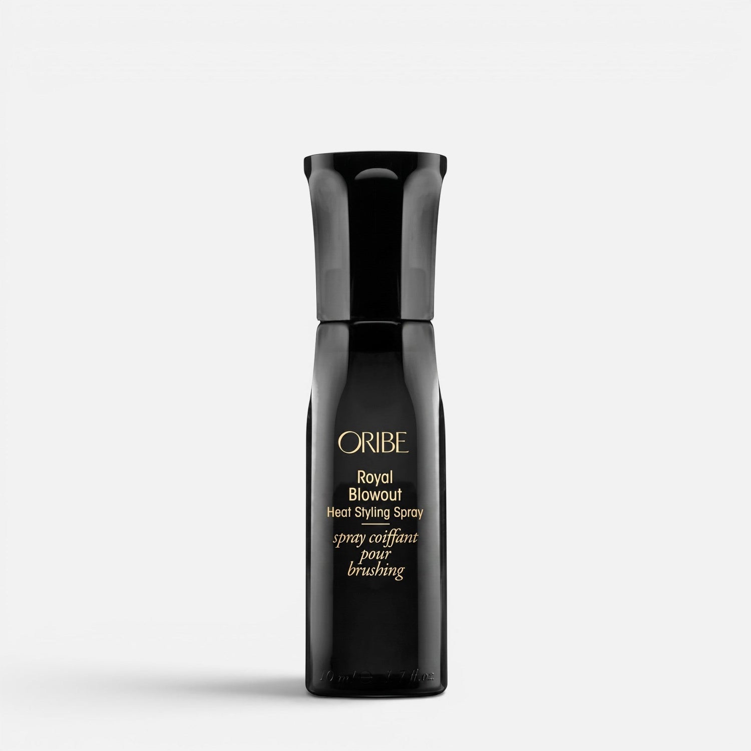 Shop Rescue Spa Oribe Royal Blowout Heat Styling Spray in a sleek black bottle for heat protection and smooth hair.