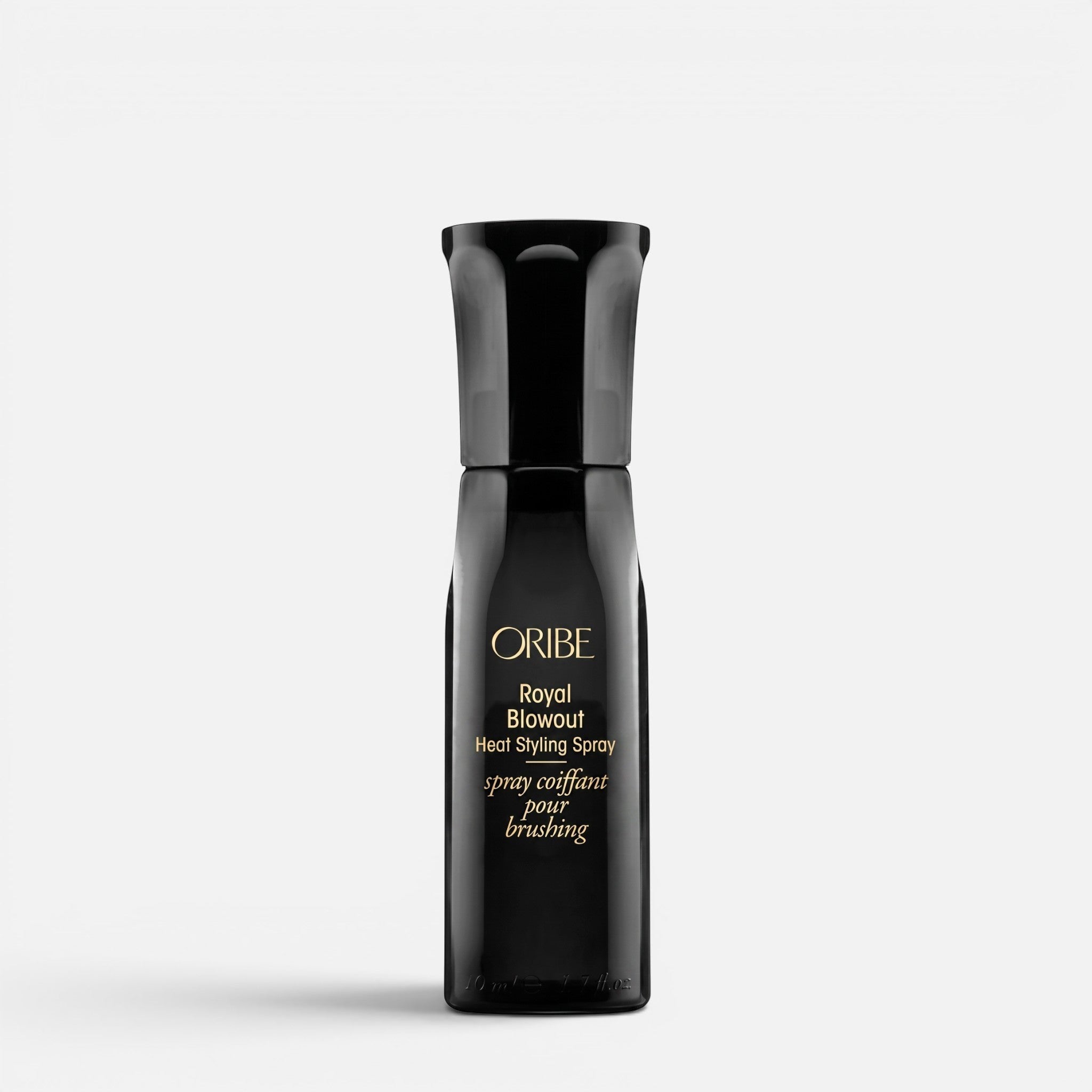 Shop Rescue Spa Oribe Royal Blowout Heat Styling Spray in a sleek black bottle for heat protection and smooth hair.