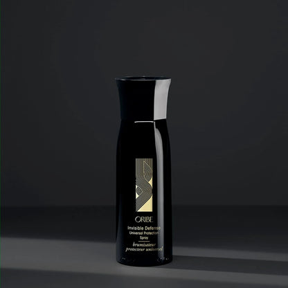 Shop Rescue Spa Oribe Invisible Defense Universal Protection Spray in a sleek black bottle for heat and UV protection.