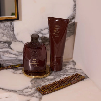 Shop Rescue Spa Oribe Conditioner for Magnificent Volume in a brown tube. Gel-like formula for fine to medium hair.