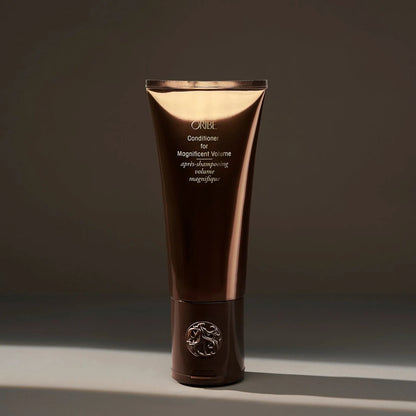 Shop Rescue Spa Oribe Conditioner for Magnificent Volume, a volumizing conditioner for fine to medium hair in a brown tube.