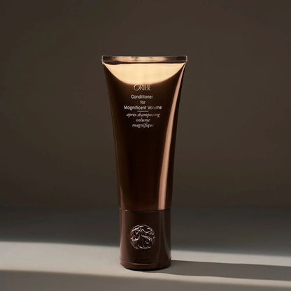 Shop Rescue Spa Oribe Conditioner for Magnificent Volume, a volumizing conditioner for fine to medium hair in a brown tube.