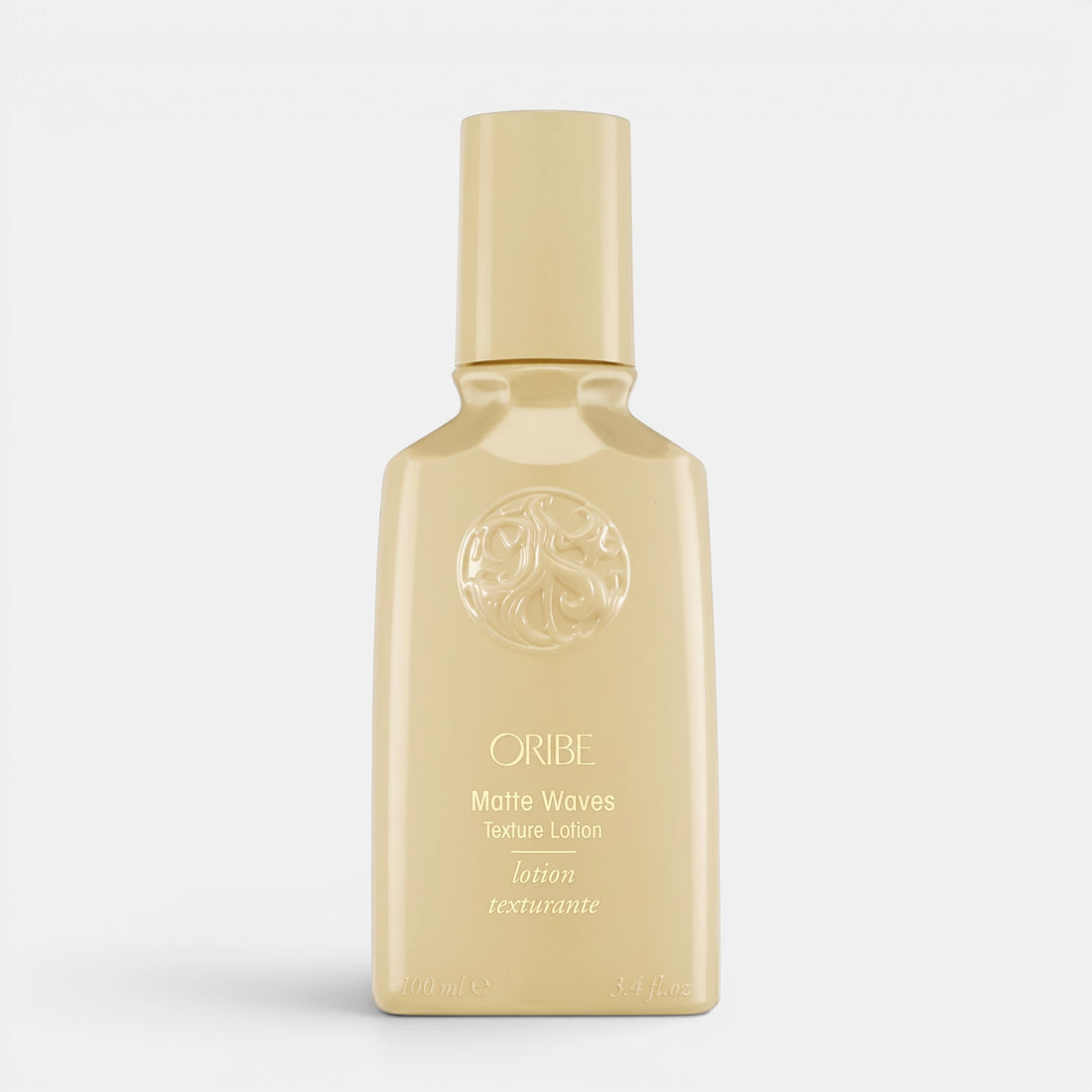 Shop Rescue Spa Oribe Matte Waves Texture Lotion in a beige bottle for beachy hair waves and matte finish