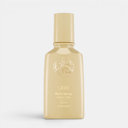Shop Rescue Spa Oribe Matte Waves Texture Lotion in a beige bottle for beachy hair waves and matte finish