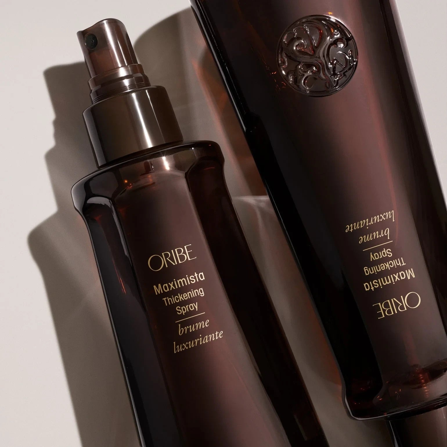 Shop Rescue Spa Oribe Maximista Thickening Spray bottles for hair volume and thermal protection.