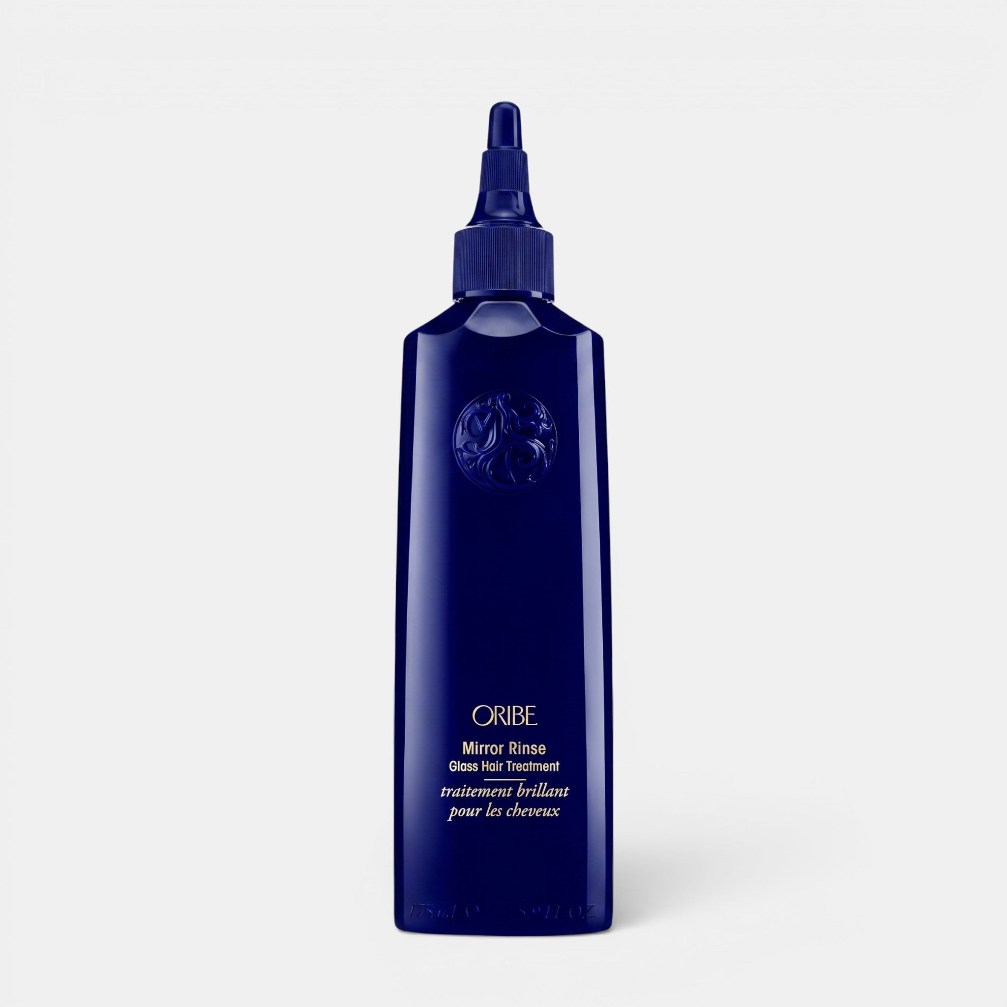 Shop Rescue Spa Oribe Mirror Rinse Glass Hair Treatment in a dark blue 175ml bottle for ultra-glossy hair shine.