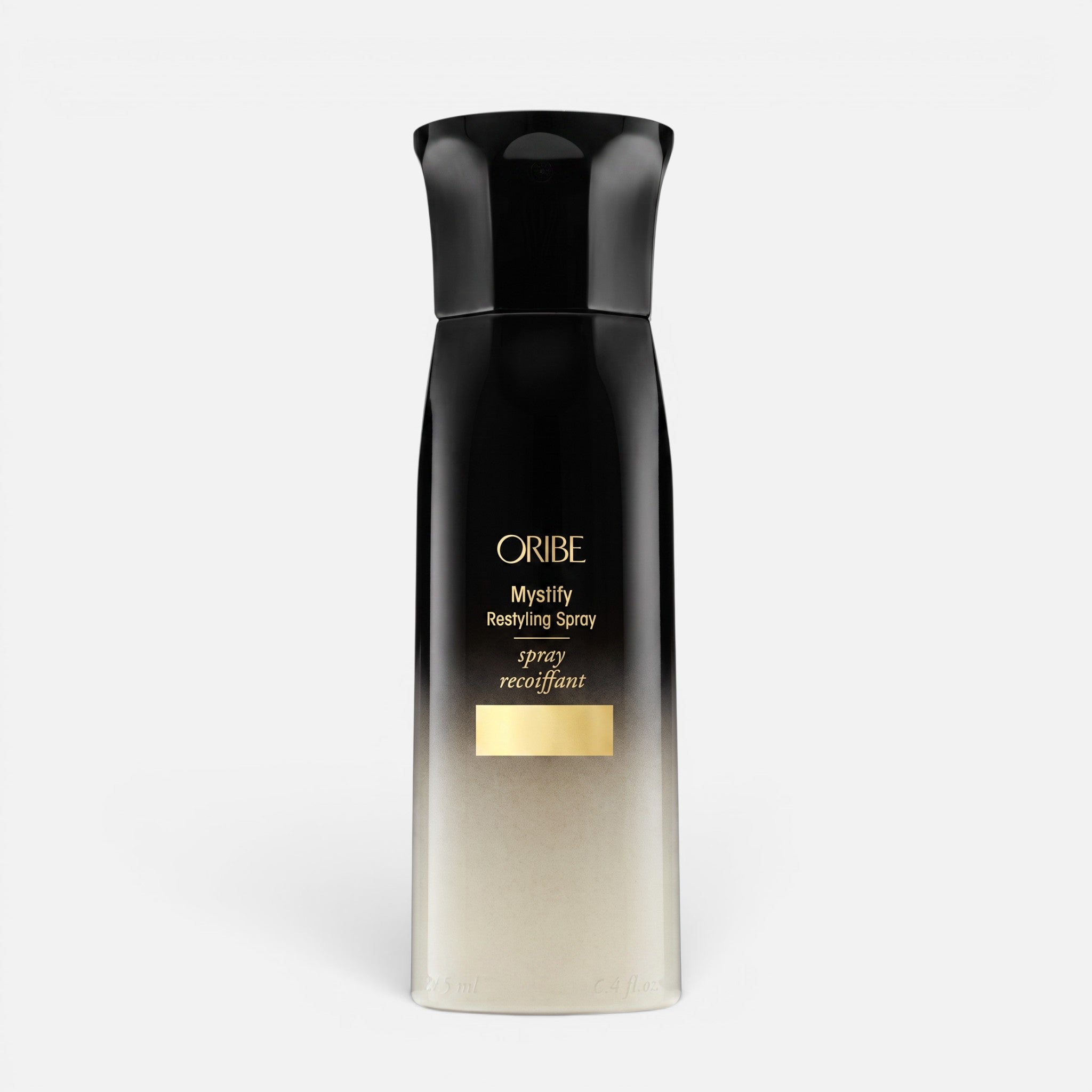 Shop Rescue Spa Oribe Mystify Restyling Spray bottle with black and gold gradient packaging for heat protection.