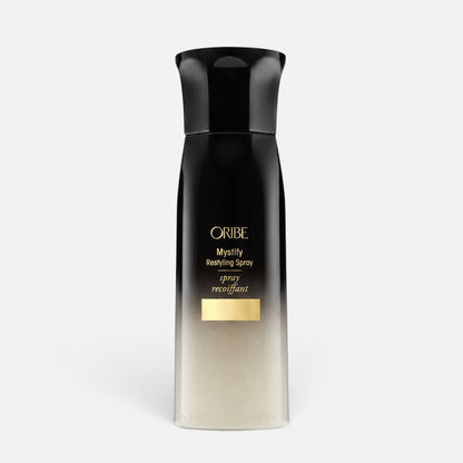Shop Rescue Spa Oribe Mystify Restyling Spray bottle with black and gold gradient packaging for heat protection.