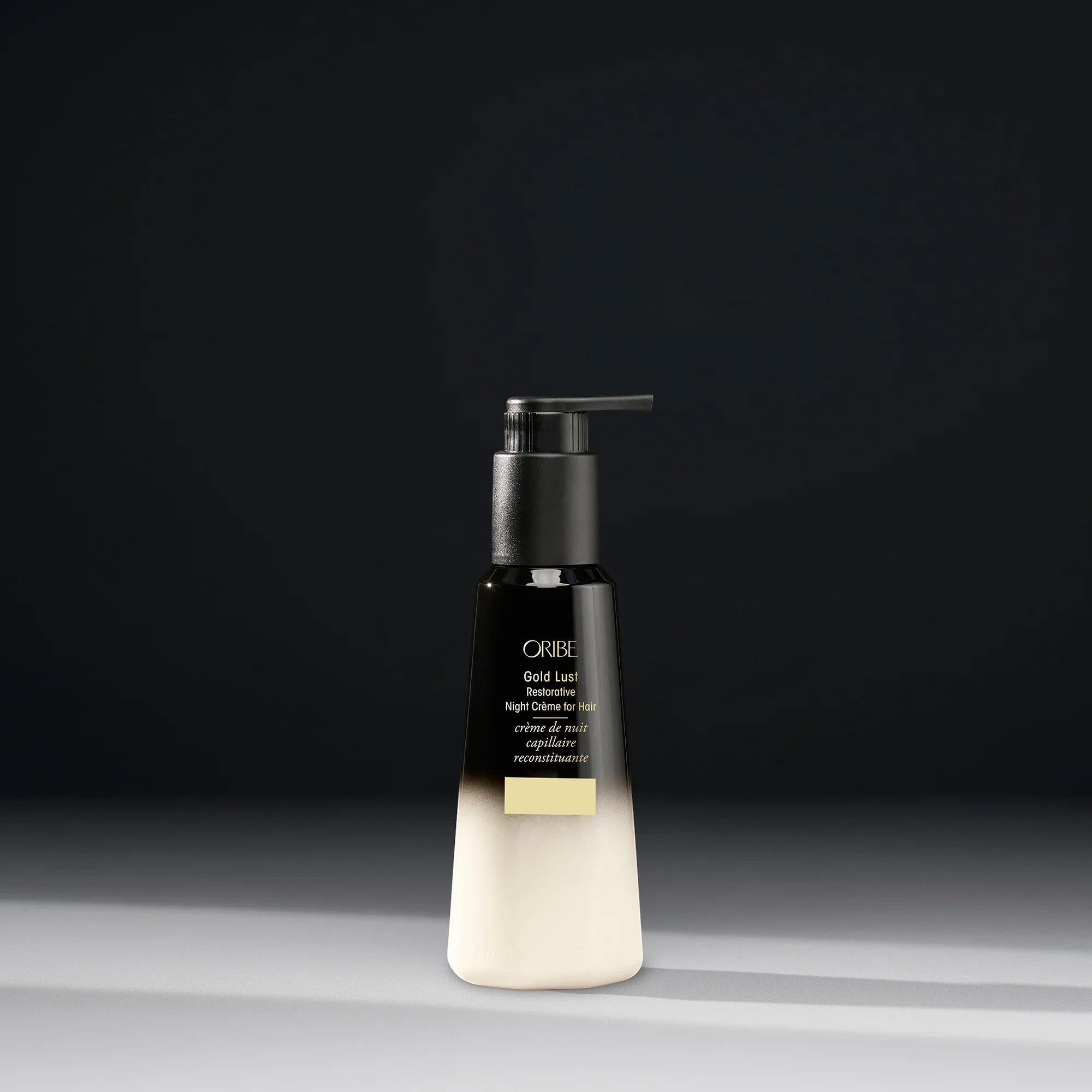 Shop Rescue Spa Oribe Gold Lust Restorative Night Creme for hair in a black and white ombre pump bottle.