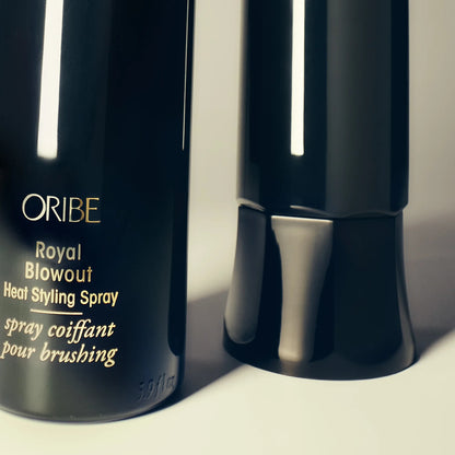 Shop Rescue Spa Oribe Royal Blowout Heat Styling Spray in a black bottle with gold text for heat protection.
