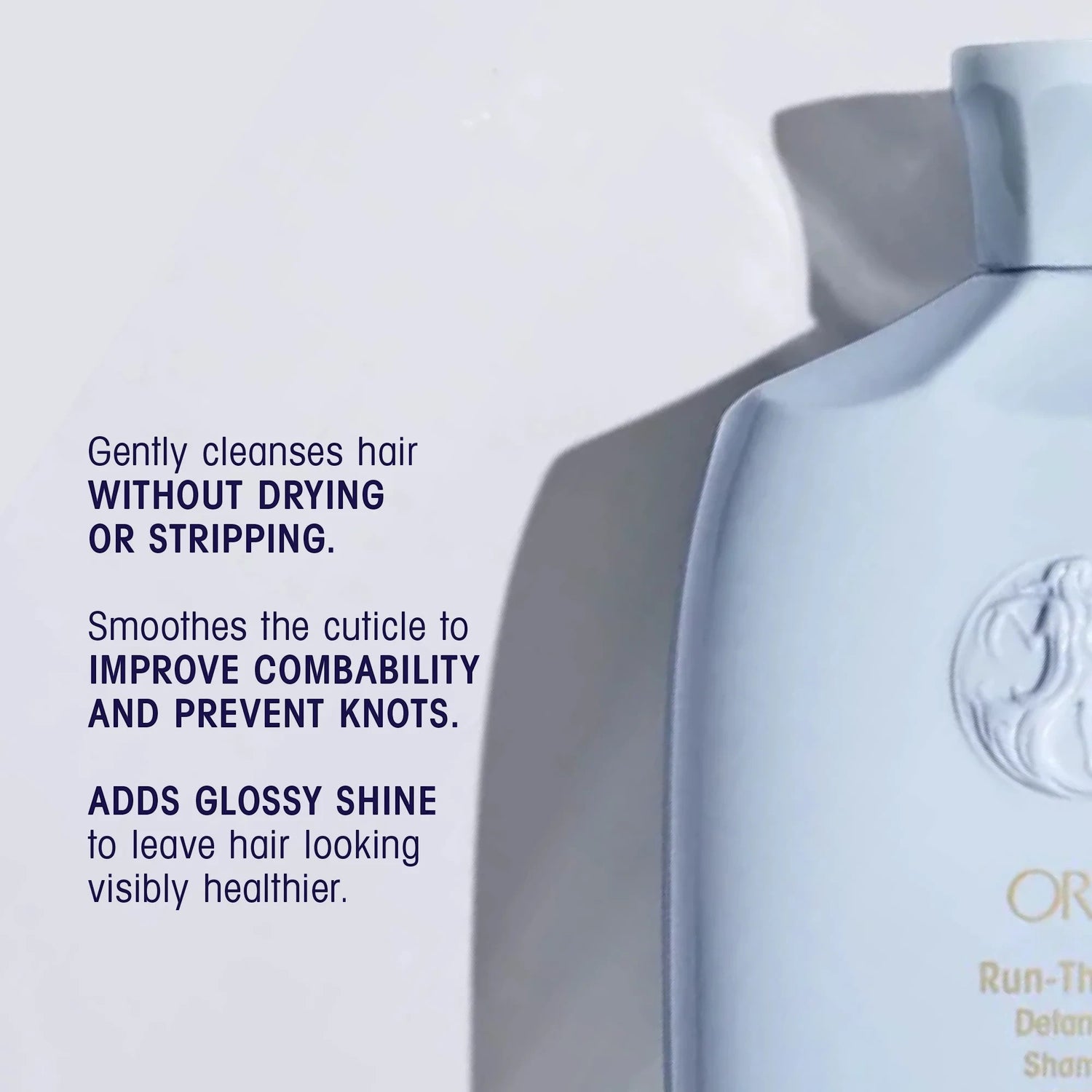 Shop Rescue Spa Oribe Run-Through Detangling Shampoo bottle, light blue, for all hair types, adds shine and moisture.