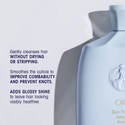 Shop Rescue Spa Oribe Run-Through Detangling Shampoo bottle, light blue, for all hair types, adds shine and moisture.