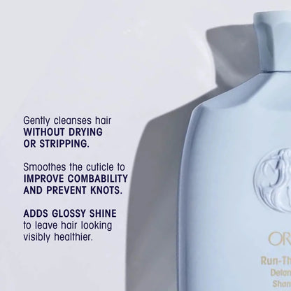 Shop Rescue Spa Oribe Run-Through Detangling Shampoo bottle, light blue, for all hair types, adds shine and moisture.