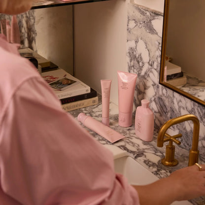 Shop Rescue Spa Oribe Serene Scalp Anti-Dandruff Shampoo in pink bottle, 250ml.