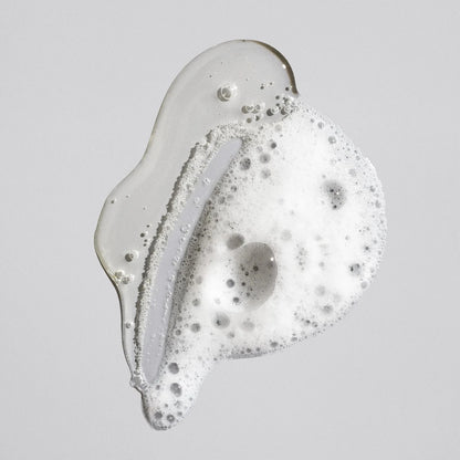 Shop Rescue Spa Oribe Signature Shampoo clear gel texture with white lather bubbles on a neutral background
