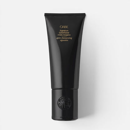 Shop Rescue Spa Oribe Signature Conditioner in a sleek black squeeze tube for restorative hair hydration.