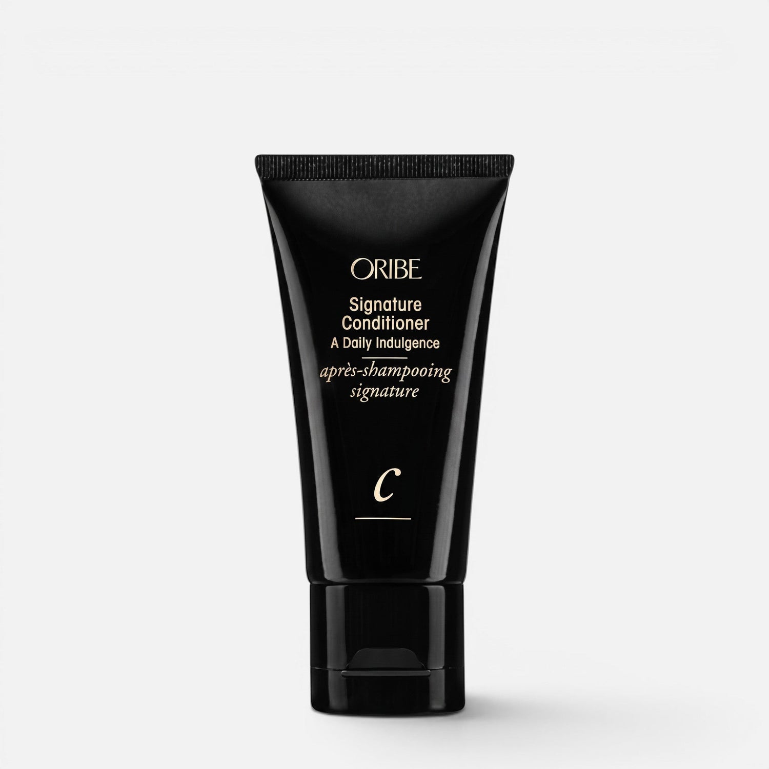 Shop Rescue Spa Oribe Signature Conditioner in a sleek black squeeze tube for daily hair moisturizing and repair.