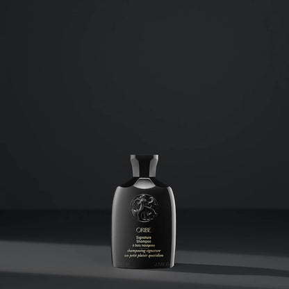 Shop Rescue Spa Oribe Signature Shampoo travel size bottle in black packaging with elegant embossed logo