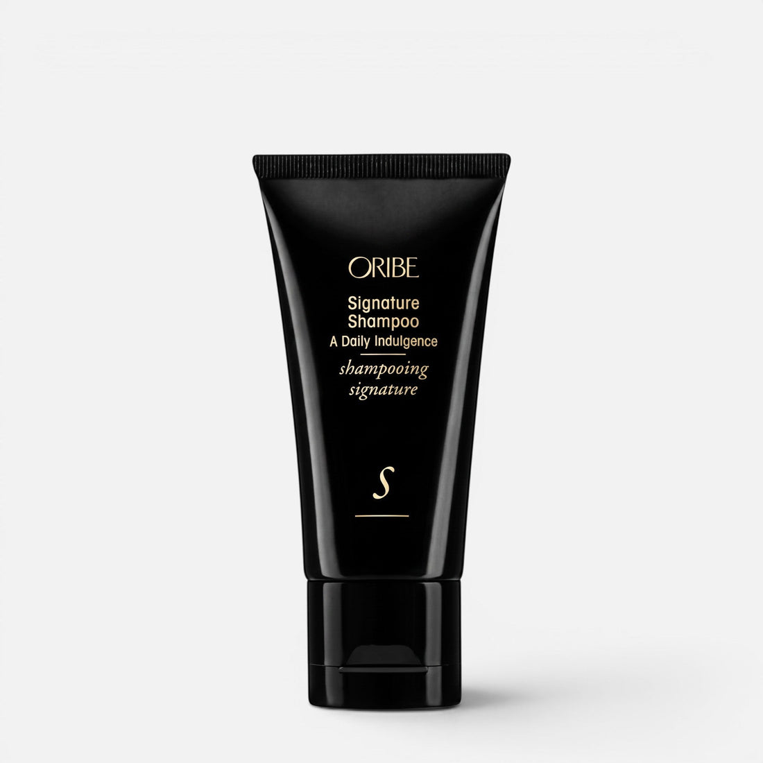 Shop Rescue Spa Oribe Signature Shampoo in a black travel-size squeeze tube with gold lettering.