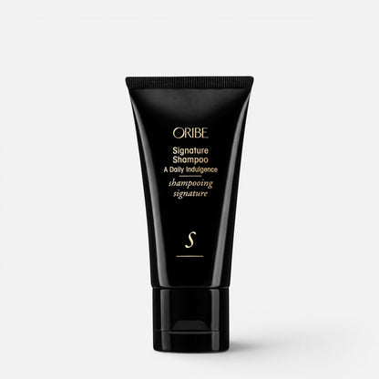 Shop Rescue Spa Oribe Signature Shampoo in a black travel-size squeeze tube with gold lettering.