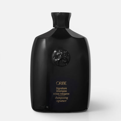 Shop Rescue Spa Oribe Signature Shampoo in a sleek black bottle with gold lettering for daily hair nourishment.