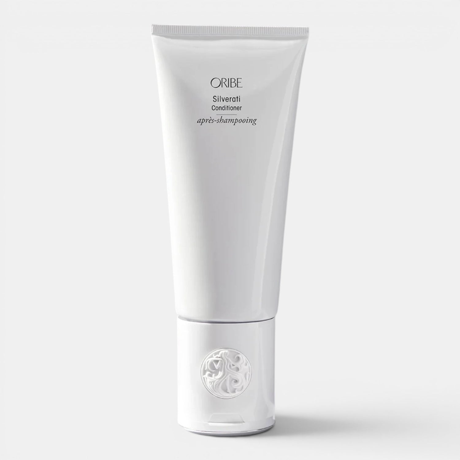 Shop Rescue Spa ORIBE Silverati Conditioner tube, a white bottle with black text, designed to brighten silver hair and banish dullness.