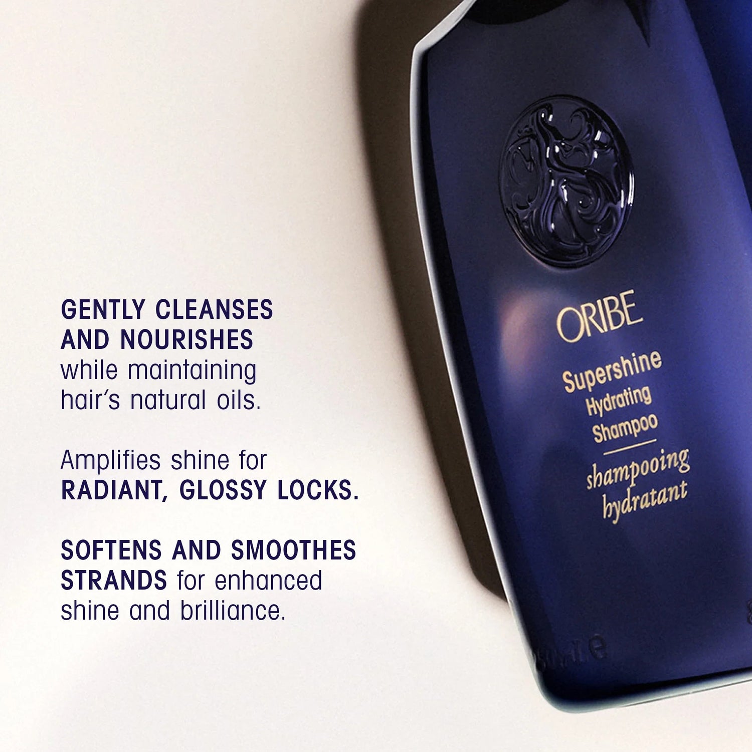 Shop Rescue Spa Oribe Supershine Hydrating Shampoo bottle, dark blue with gold lettering, for glossy, hydrated hair.