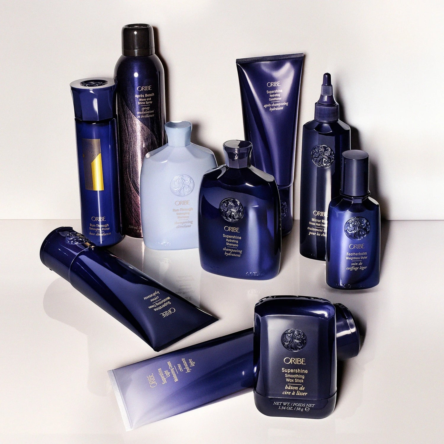 Shop Rescue Spa Oribe Supershine Smoothing Wax Stick for taming frizz and flyaways with a polished finish.