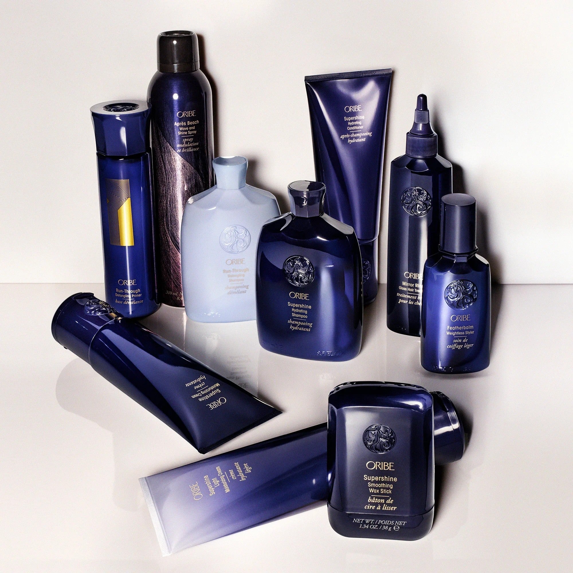 Shop Rescue Spa Oribe Supershine Smoothing Wax Stick for taming frizz and flyaways with a polished finish.