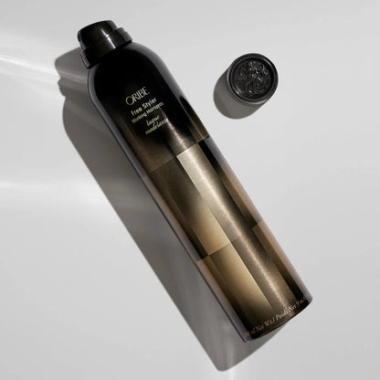Shop Rescue Spa Oribe Free Styler Working Hairspray, a black can with gold geometric pattern, offers light, brushable hold with a satin finish.