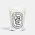 Shop Rescue Spa Ortie scented candle in a clear glass vessel with a signature oval label featuring green wax.