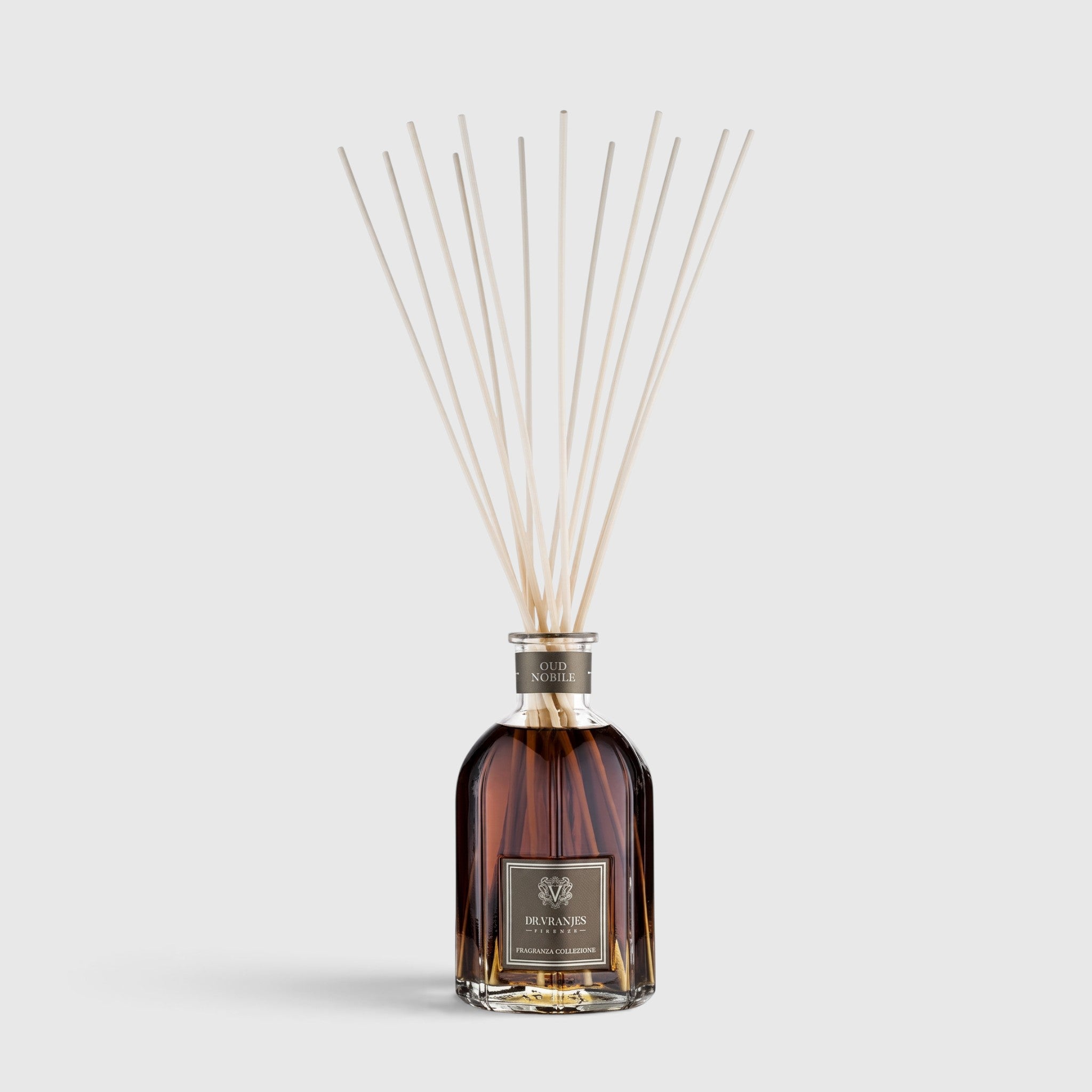 Shop Rescue Spa Oud Nobile room diffuser in a glass bottle with reed sticks for a smoky, woody home fragrance.