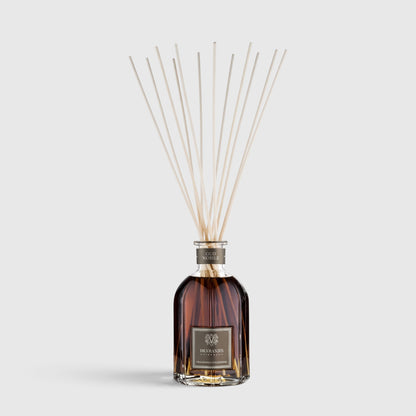 Shop Rescue Spa Oud Nobile room diffuser in a glass bottle with reed sticks for a smoky, woody home fragrance.