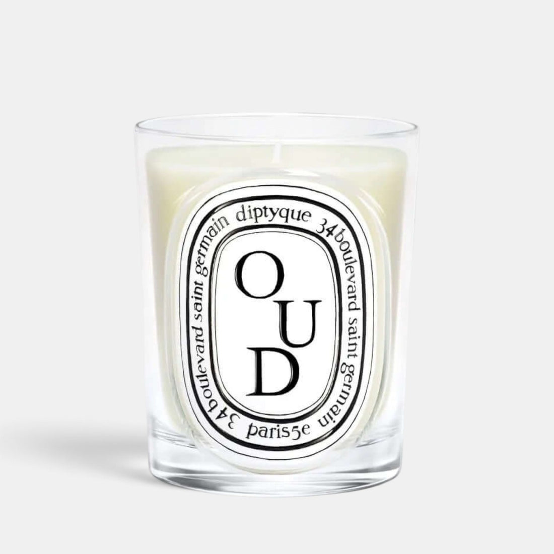 Shop Rescue Spa Oud scented candle in a clear glass vessel with a signature oval label