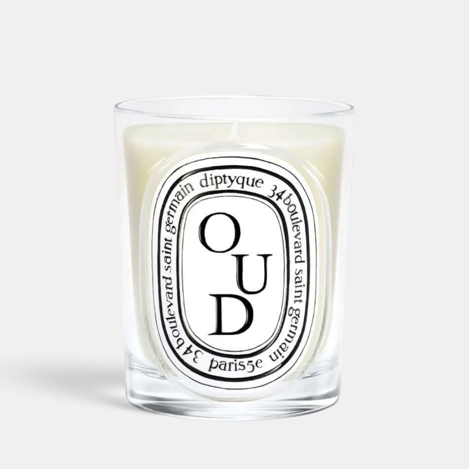 Shop Rescue Spa Oud scented candle in a clear glass vessel with a signature oval label