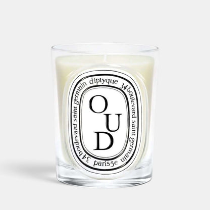 Shop Rescue Spa Oud scented candle in a clear glass vessel with a signature oval label