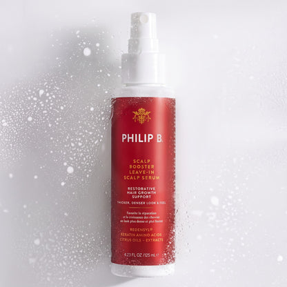 Shop Rescue Spa Philip B. Scalp Booster leave-in serum bottle with water droplets on a white background.