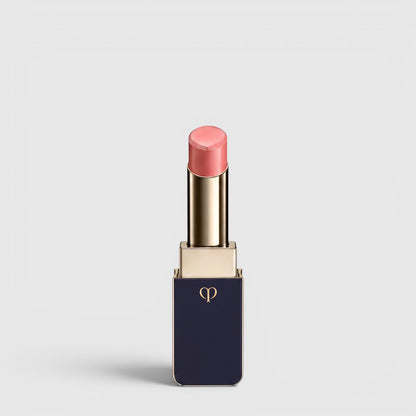 Shop Rescue Spa Lipstick Shine in a soft pink shade with a luminous dewy finish in a sleek navy and gold tube.