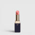 Shop Rescue Spa Lipstick Shine in a soft pink shade with a luminous dewy finish in a sleek navy and gold tube.