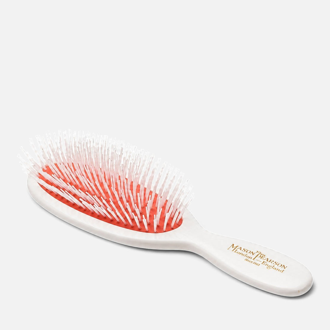 Shop Rescue Spa Pocket Nylon Brush N4 with white handle, red rubber cushion, and five rings of nylon tufts.