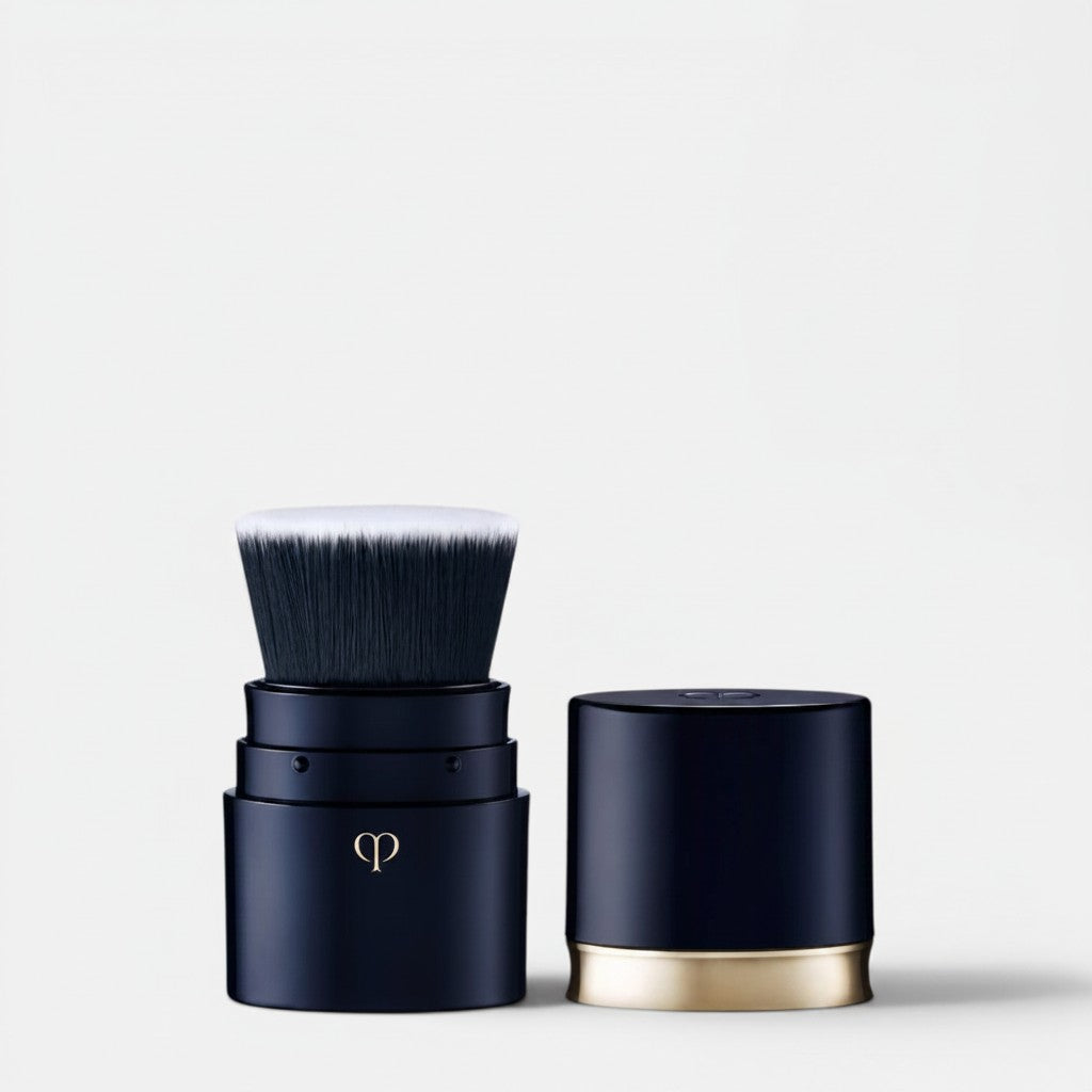 Shop Rescue Spa portable foundation brush with dense, silky synthetic fibers and a navy case with gold accent.