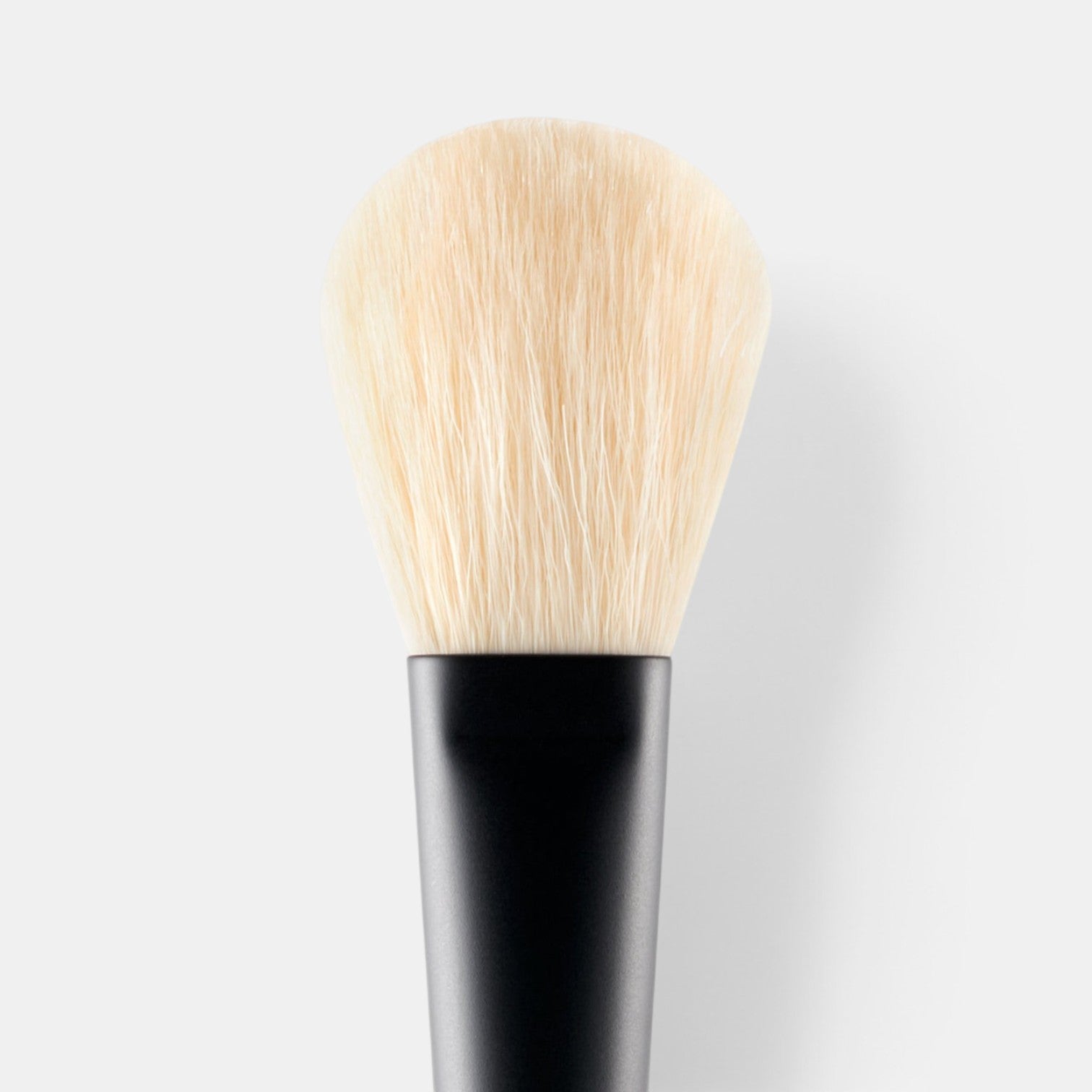 Shop Rescue Spa powder brush with soft, dense, cruelty-free nylon bristles and a sleek black lacquered hardwood handle.
