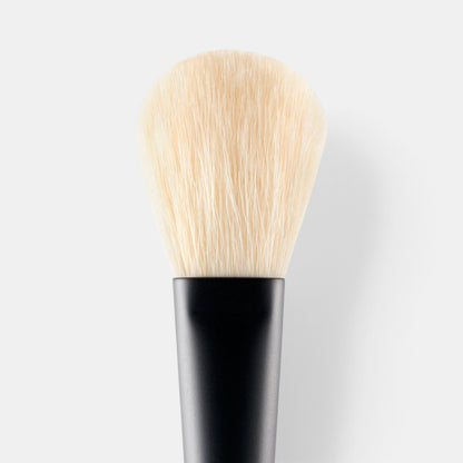 Shop Rescue Spa powder brush with soft, dense, cruelty-free nylon bristles and a sleek black lacquered hardwood handle.