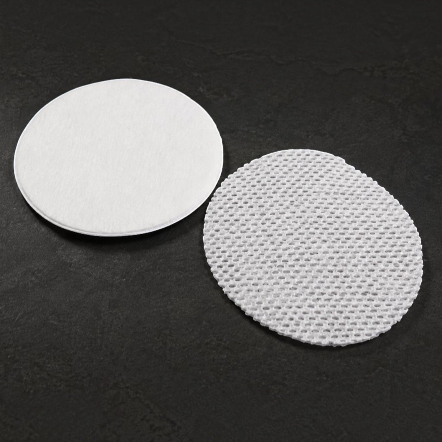 Shop Rescue Spa premium cotton rounds featuring a smooth side and a removable textured gauze layer for exfoliation.