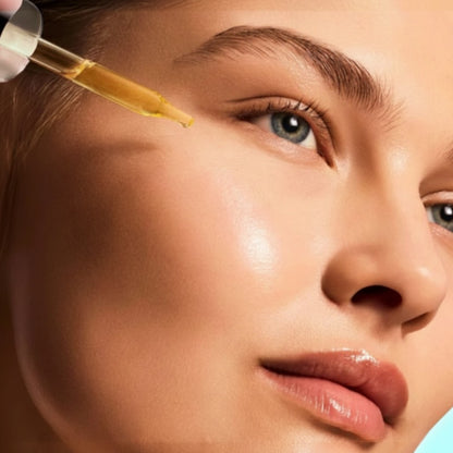 Shop Rescue Spa iS CLINICAL Pro-Heal Serum Advance being applied with a dropper to a woman&